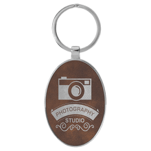 Load image into Gallery viewer, Rustic/Silver 3" x 1 3/4" Laserable Leatherette/Metal Oval Keychain