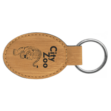 Load image into Gallery viewer, Bamboo 3" x 1 3/4" Laserable Leatherette Oval Keychain
